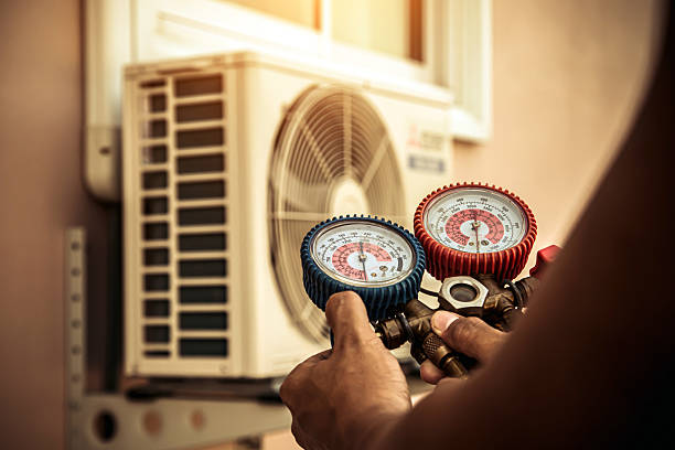 Professional Air Conditioning Service technician working in Craig, MO